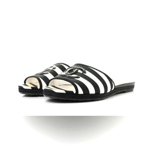 CHANEL black and white striped mules.